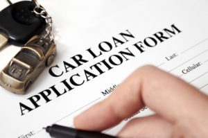 filling out car loan application form